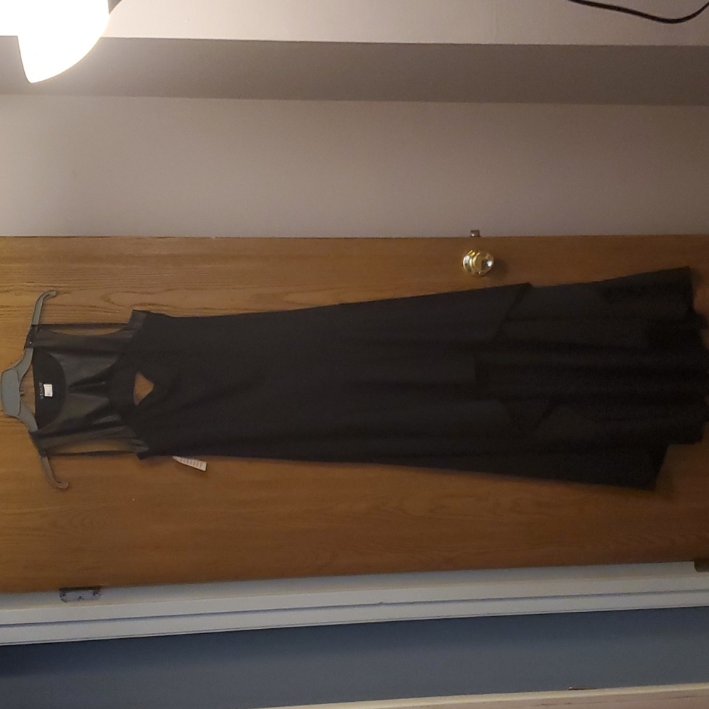 Maxi black dress with peekaboo cutouts in the front and back.